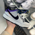 Zapatilla Nike Plano Blanco y Morado