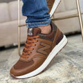 Zapatilla New Balance 574 Cafe y Blanco